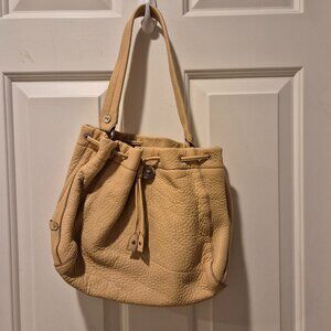 Cole Haan pebbled leather drawstring handbag